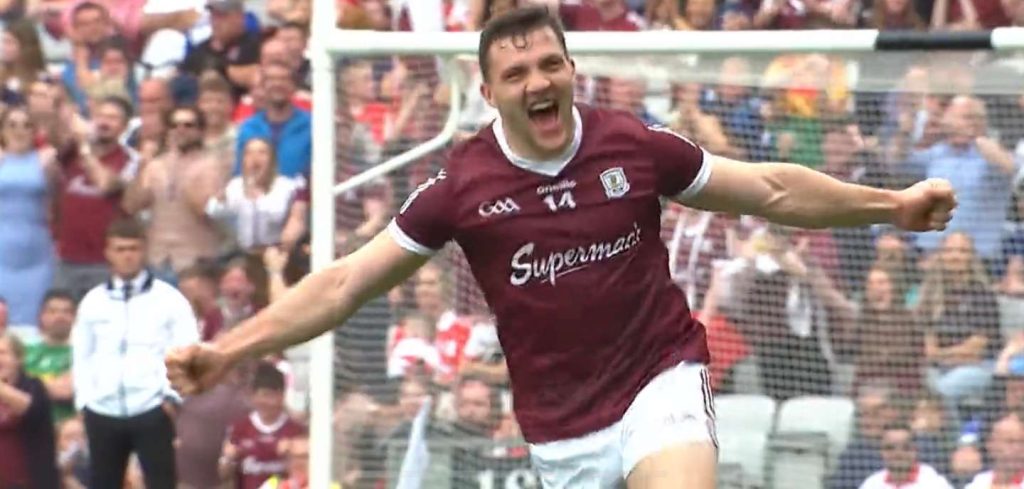 Damian Comer celebrates scoring a goal against Derry